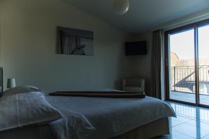Postel nebo postele na pokoji v ubytování Motel Le Léman