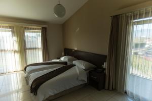 Postel nebo postele na pokoji v ubytování Motel Le Léman