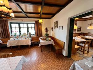 a dining room with two tables and chairs and tablesktop at Ferienhof Stanzl in Rappottenstein