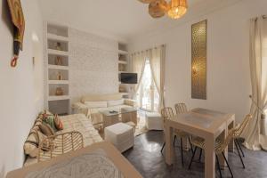 a living room with a couch and a table at Riad Origines in Marrakesh