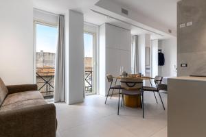 a living room with a couch and a table at Suite 33 - Boutique Apartments in San Benedetto del Tronto