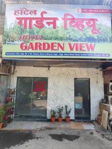 a sign for a hotel garden view on a building at Hotel Garden View - Andheri West in Mumbai
