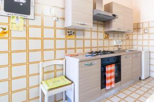 a small kitchen with a stove and a sink at Villa Preside in Noto Marina