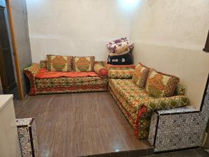 a living room with two couches and a couch at La Casa de Larache in Larache