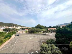 an empty parking lot with a car parked in it at Luna e Sentidu in Villaputzu +5 photos