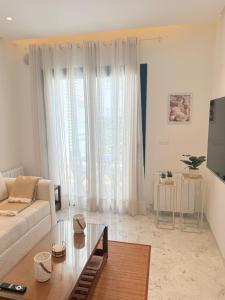 a living room with a couch and a table at Breeze La Marsa in Tunis