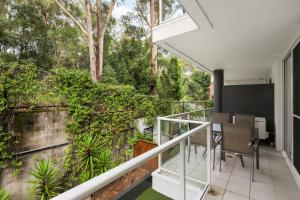 an open balcony with a table and chairs on it at Solara at Aqua Mantra in Nelson Bay