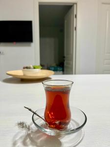 a glass of tea sitting on a table at Sunrise House in Cholpon-Ata