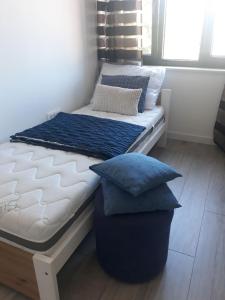 a bed with pillows on it in a room at Eco-Luxury Suite Luna in Umag