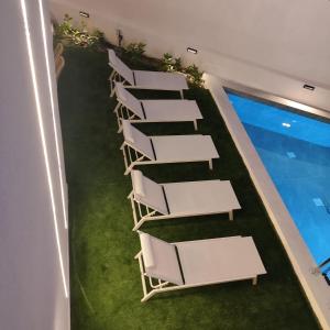 an overhead view of a row of white chairs at 7 Suites in Skiathos