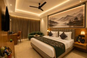 a bedroom with a large bed with a painting on the wall at Airport Premier In With Free Airport Drop in New Delhi +73 photos
