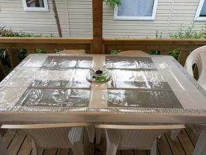 a table with plastic on it on a deck at L'échapée verte in Litteau +7 photos