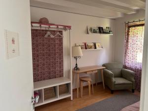 a room with a desk and a chair and a window at Fastuc B&B in Ponte nellʼAlpi +37 photos