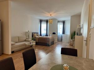 a living room with a couch and a table at Excelsior in Graz