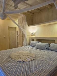 a bedroom with a large bed with a large rug on it at Ocean zuri villa in Watamu