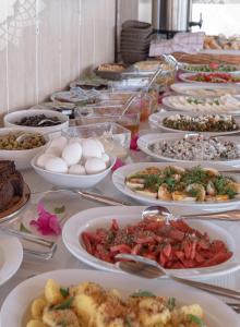 a buffet line with plates of food on a table at meltem pansiyon in Kaş