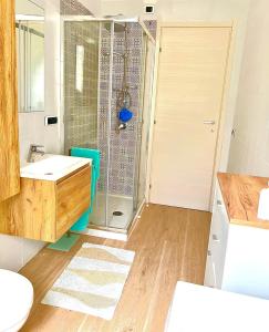 a bathroom with a shower and a sink at Cussorgia's House in Calasetta +15 photos