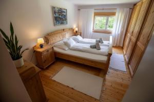 a bedroom with a bed and a window at Frein Chalets - Kaltenbach in Frein
