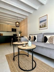 a living room with a couch and a table at Forest House Pobierowo in Pobierowo