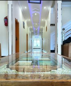 a room with a glass floor in a building at Relax in in Skardu