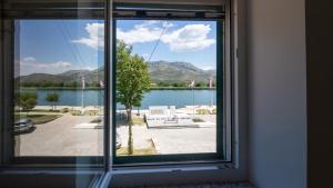 a view of a lake from a window at House Antonia by Villas Guide in Opuzen