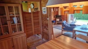 a living room with a table and a dining room at Feriennest Buendorf in Dahlenburg