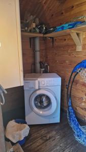 a washer and dryer sitting in a room at Feriennest Buendorf in Dahlenburg +21 photos