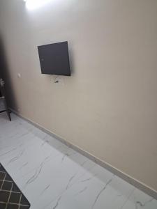 a flat screen tv on a white wall at Sundervan Resort in Alwar