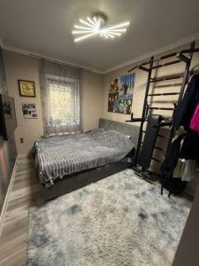 a bedroom with a bed and a fan at Villa in Uman