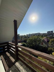 a wooden bench sitting on the side of a house at Villa in Uman