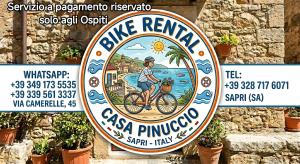a sign for a pizza restaurant with a man riding a bike at Casa Pinuccio Sapri in Sapri