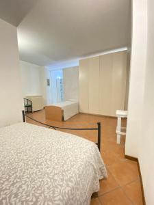a bedroom with a bed and a room with a bed sqor at GMD Sweet Home in Policoro