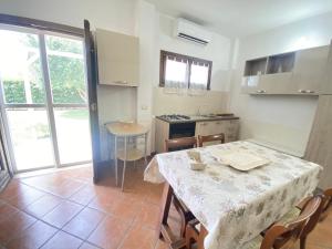 a kitchen and dining room with a table and chairs at GMD Sweet Home in Policoro +27 photos