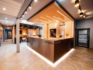 an office lobby with a reception desk in a building at B&B HOTEL Wien-Heiligenstadt in Vienna