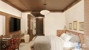 a bedroom with a bed and a flat screen tv at The Noria Hotel in Arsuz