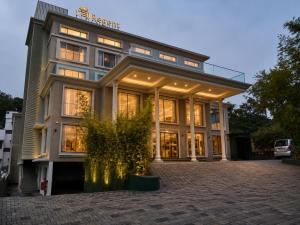 a large building with a lot of windows at Raj Regent Manarcadu in Kanjirapalli