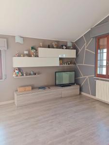 a living room with a flat screen tv on a wall at La Rondine Atessa in Atessa