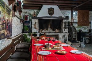 a table with a red table cloth on it at Villa Ploski in Ploski