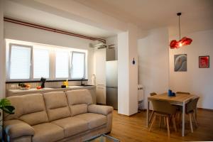 a living room with a couch and a table at MD Beach Home in Roseto degli Abruzzi