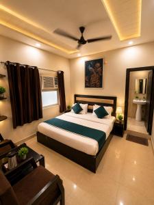 a bedroom with a large bed in a room at Hotel Gopal in Haridwār +100 photos
