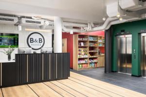 a store with a bdb works sign on the wall at B&B HOTEL Kalisz Centrum in Kalisz