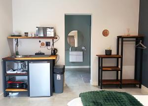 a room with a counter and a mirror on the wall at Unit 9 Dinas Accommodation Oranjemund in Oranjemund
