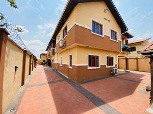 a building with a sidewalk in front of it at One Bedroom, Double bed and one sofa bed in Iseri