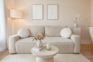 a living room with a couch and a table at Baltic Studio No 5 in Scharbeutz