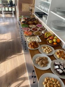 a buffet line with many different types of food at KEMAL STONE HOUSE HOTEL. in Uçhisar