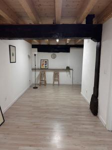 a room with a table and two stools in it at Posada Inés in Castro-Urdiales +1 photo