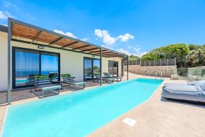 a swimming pool in a house at Rodia Luxury Villa in Plakias