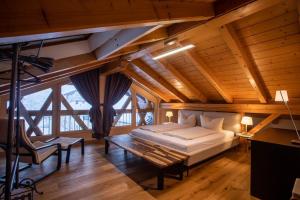 a bedroom with a bed and a wooden ceiling at Ferienwohnung Daniel in Garmisch-Partenkirchen