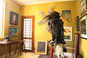 a room with a statue of an eagle on the wall at Hangman's Lookout in Calitzdorp