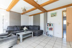 a living room with a couch and a table at Ferienhaus Neeb in Gammendorf